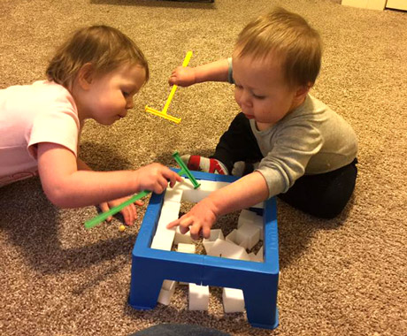 Toddlers playing break the ice